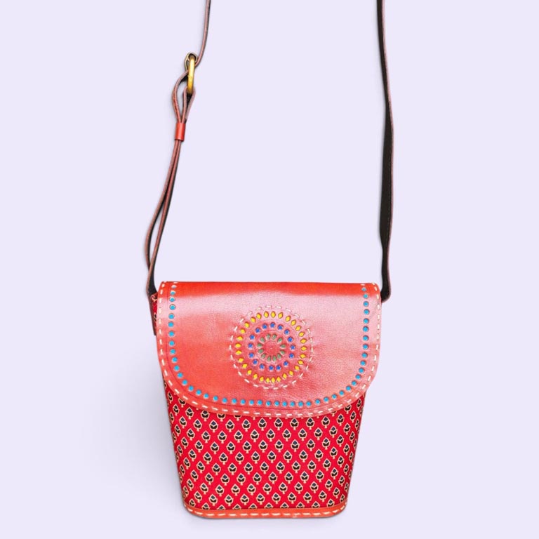 More than an everyday accessory, the Handcrafted Ajrakh Leather Sling Bag celebrates the beauty of Indian craftsmanship through a modern and versatile design. The combination of leather and Ajrakh-inspired artistry makes it a distinctive addition to any wardrobe. Carry the timeless spirit of Indian craftsmanship wherever you go with this beautifully handcrafted Ajrakh leather sling bag.